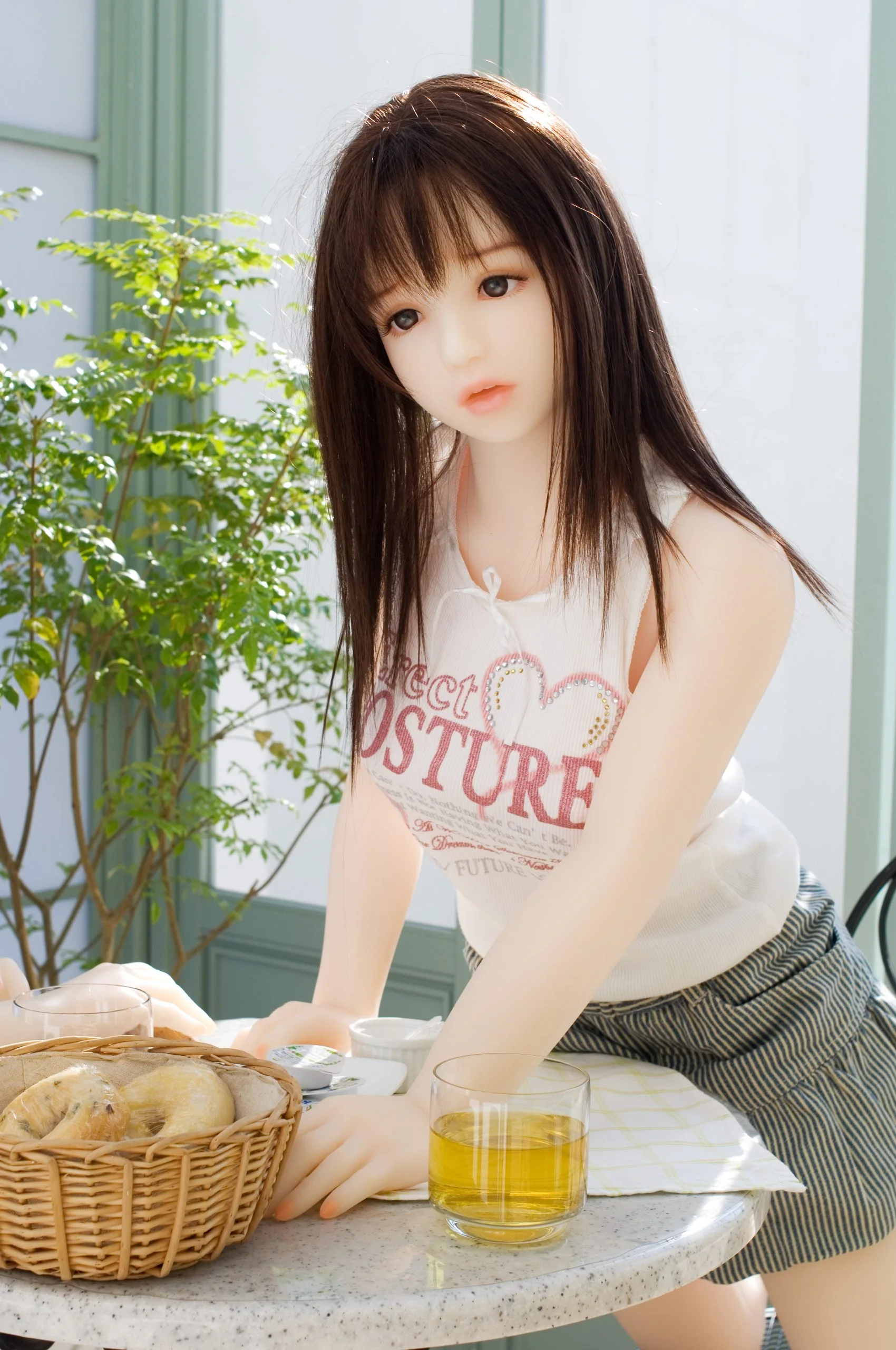 Orient Industry premium Japanese love doll realistic lifestyle scene sitting at table