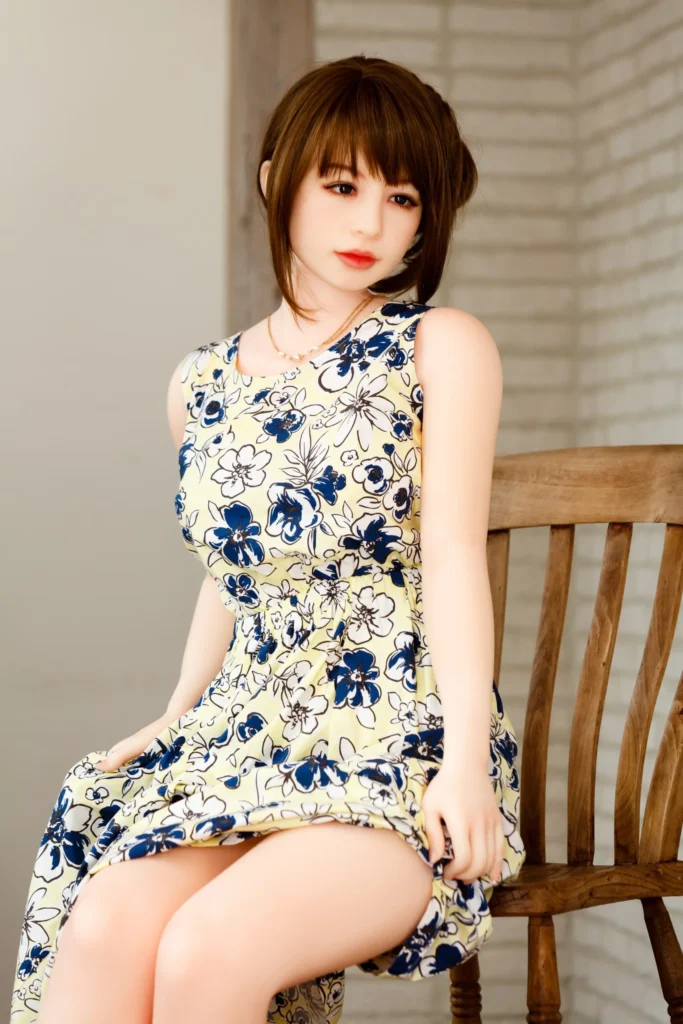 Yasuragi Kurihara Madoka premium Japanese love doll by Orient Industry with fair skin sitting on chair