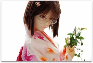 Realistic Japanese love doll wearing a navy yukata in a natural outdoor setting