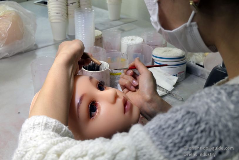 Japanese love doll makeup process performed by skilled artisans during manufacturing at the Orient Industry workshop