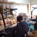 Artisans finishing Japanese love doll heads at the Orient Industry workshop in Japan
