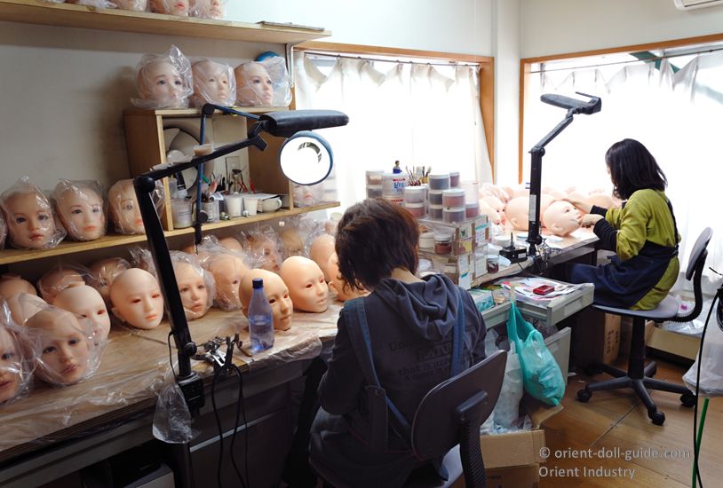 Head finishing workshop where artisans complete the facial details of Japanese love dolls
