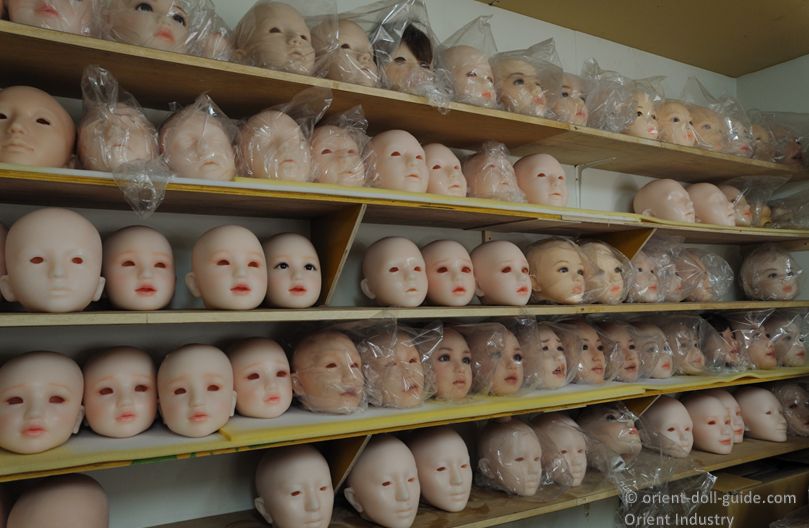 Shelves of Japanese love doll heads during the manufacturing process at the Orient Industry workshop